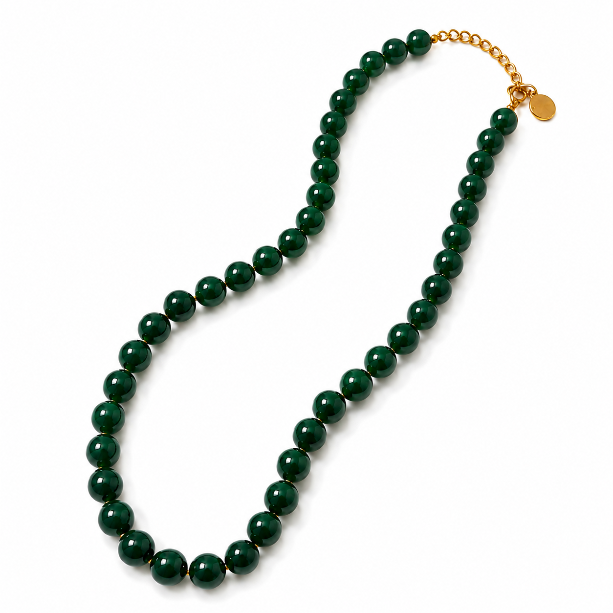 A beaded necklace made of glossy dark green round beads with a gold-tone chain extender and small round gold tag