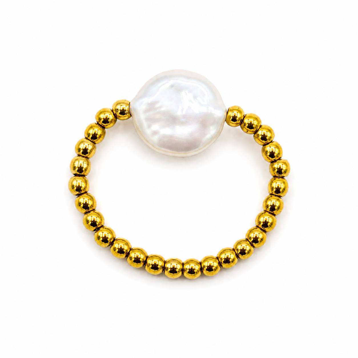 A gold beaded ring featuring a large, irregular white freshwater pearl as the centerpiece