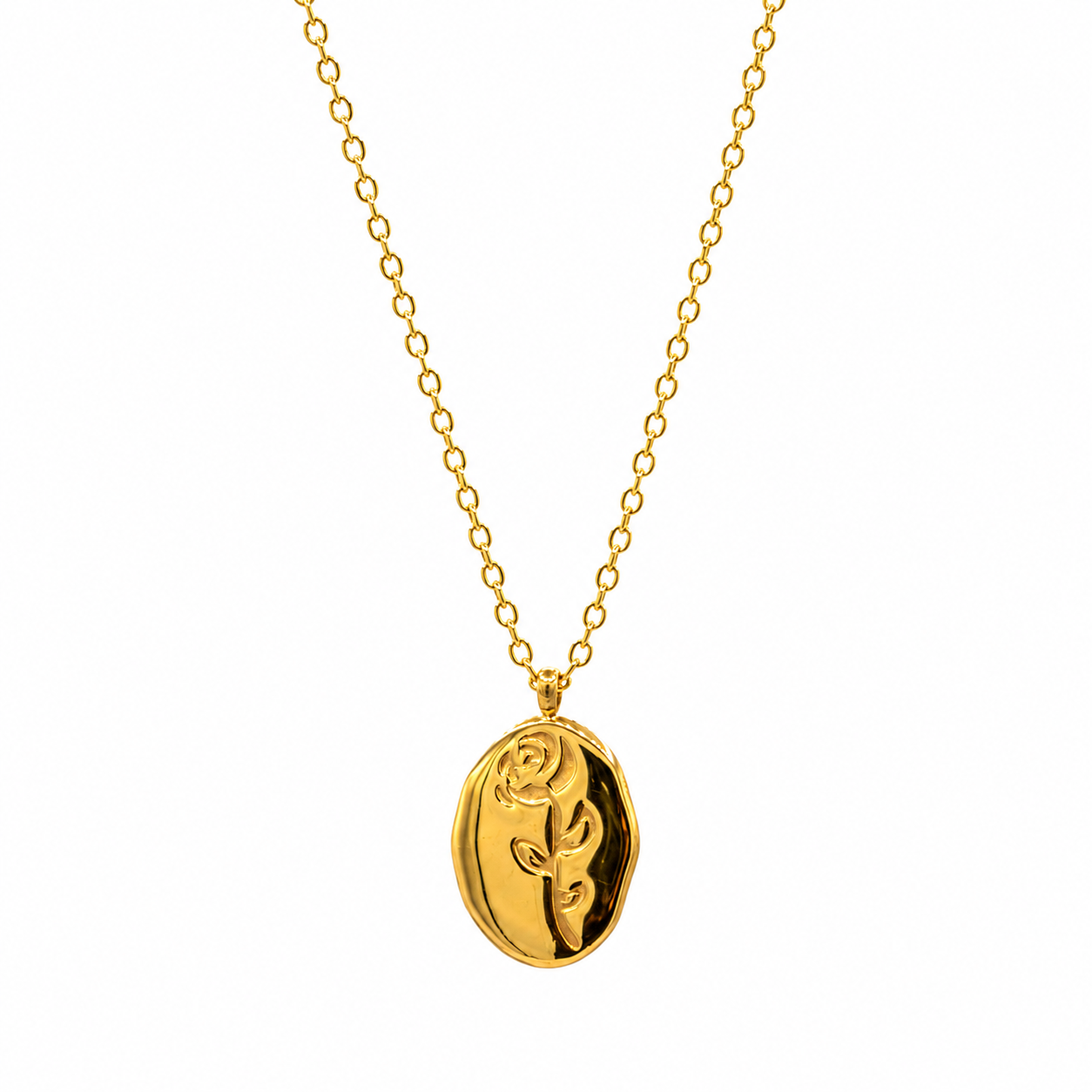 A gold pendant necklace featuring a polished oval charm with an embossed rose design, suspended from a delicate gold chain