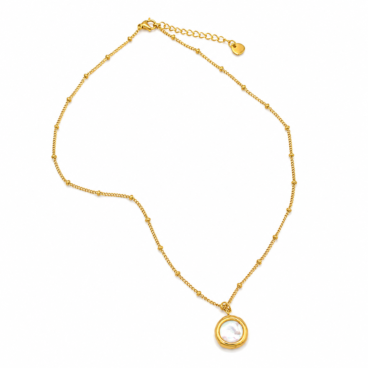 A delicate gold chain necklace featuring a small circular bezel-set pendant with a white iridescent inlay