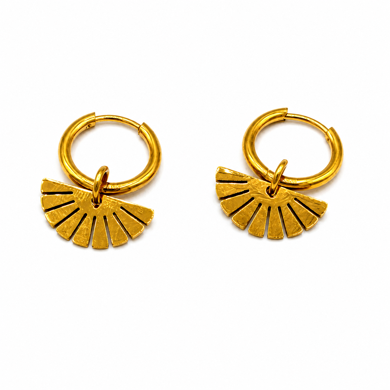 A pair of gold hoop earrings with a small fan-shaped dangling charm