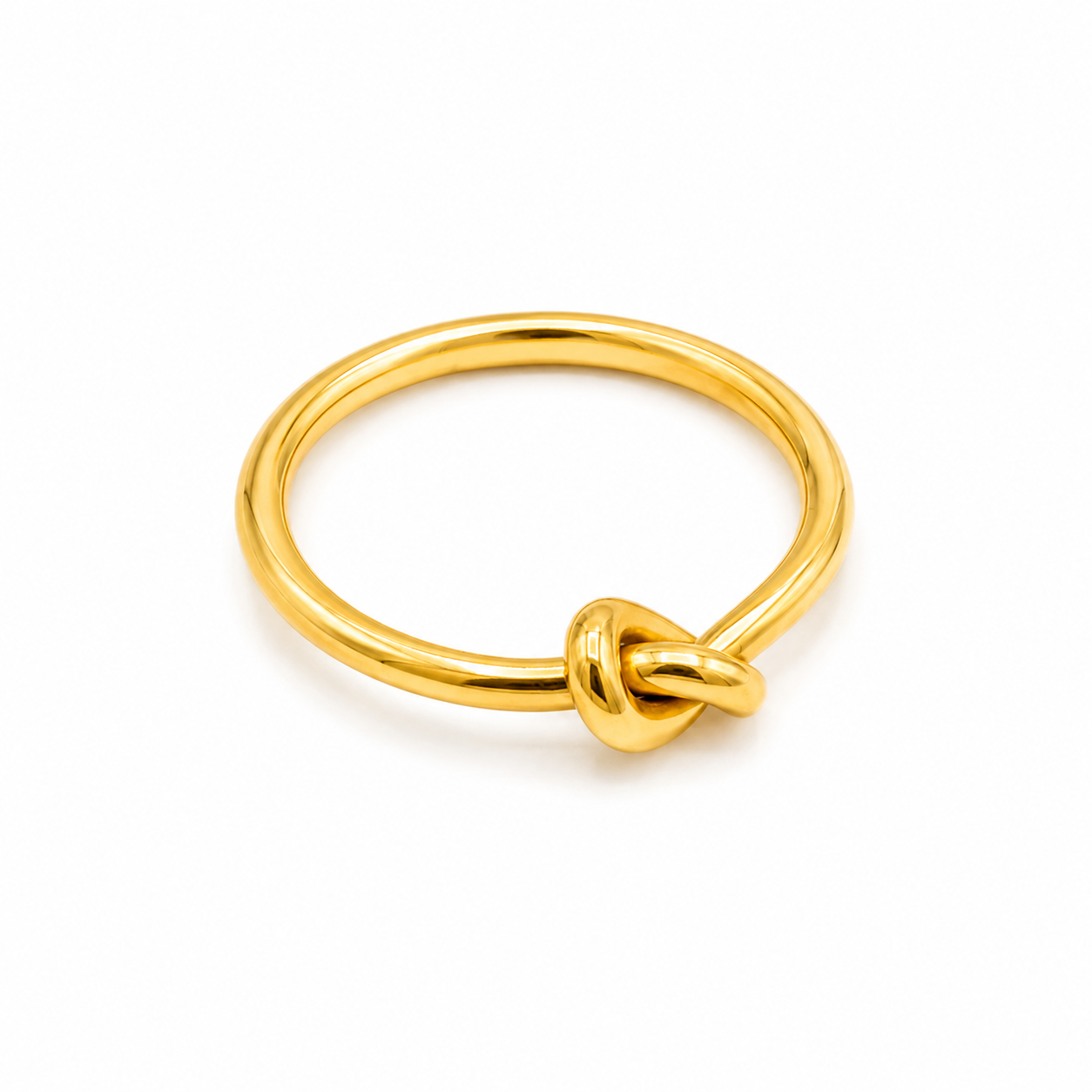 A polished yellow gold ring featuring a knotted detail at the front