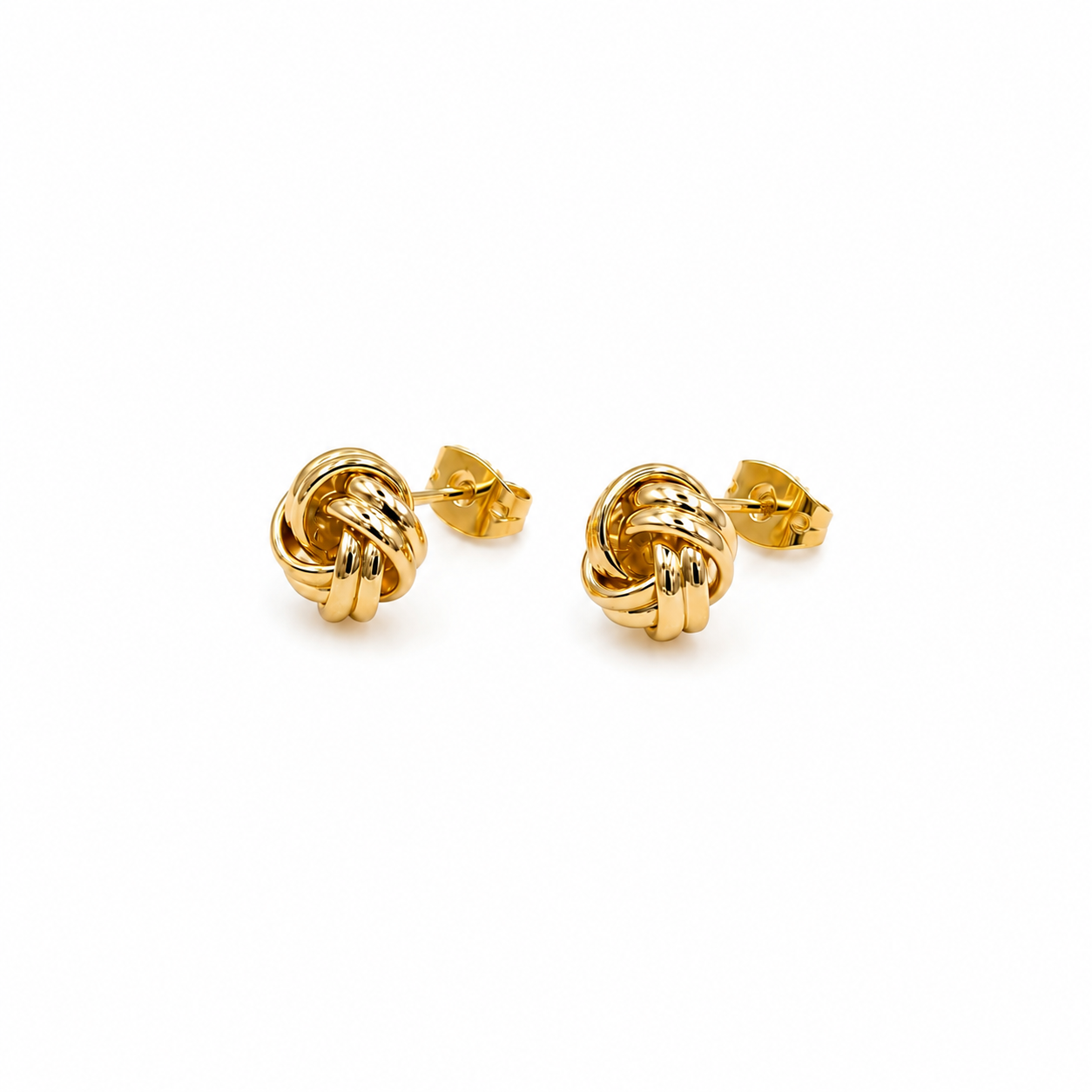 A pair of gold knot stud earrings