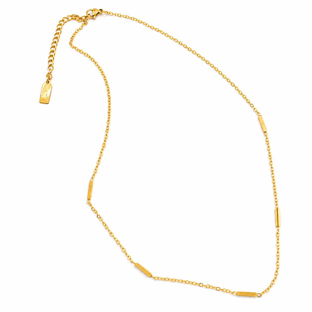A gold chain necklace with five small, flat rectangular bar accents spaced along the chain