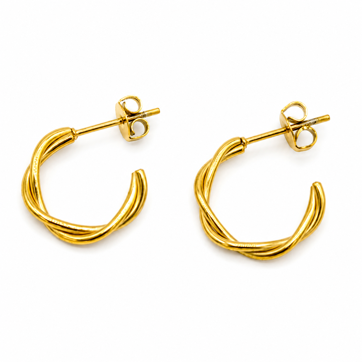 A pair of gold huggie hoop earrings with a twisted, ribbed design and butterfly backings
