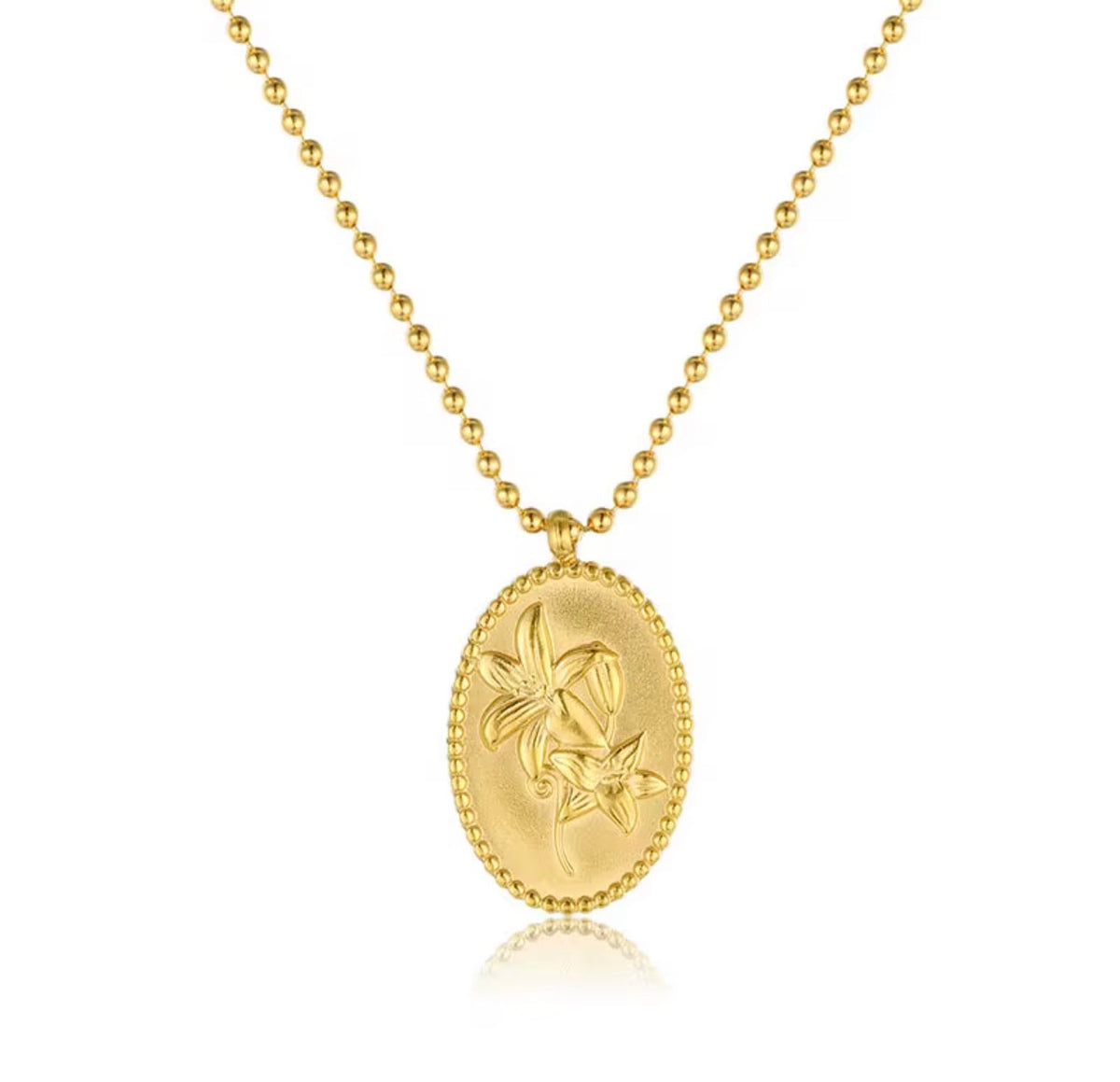Gold necklace with a decorative pendant