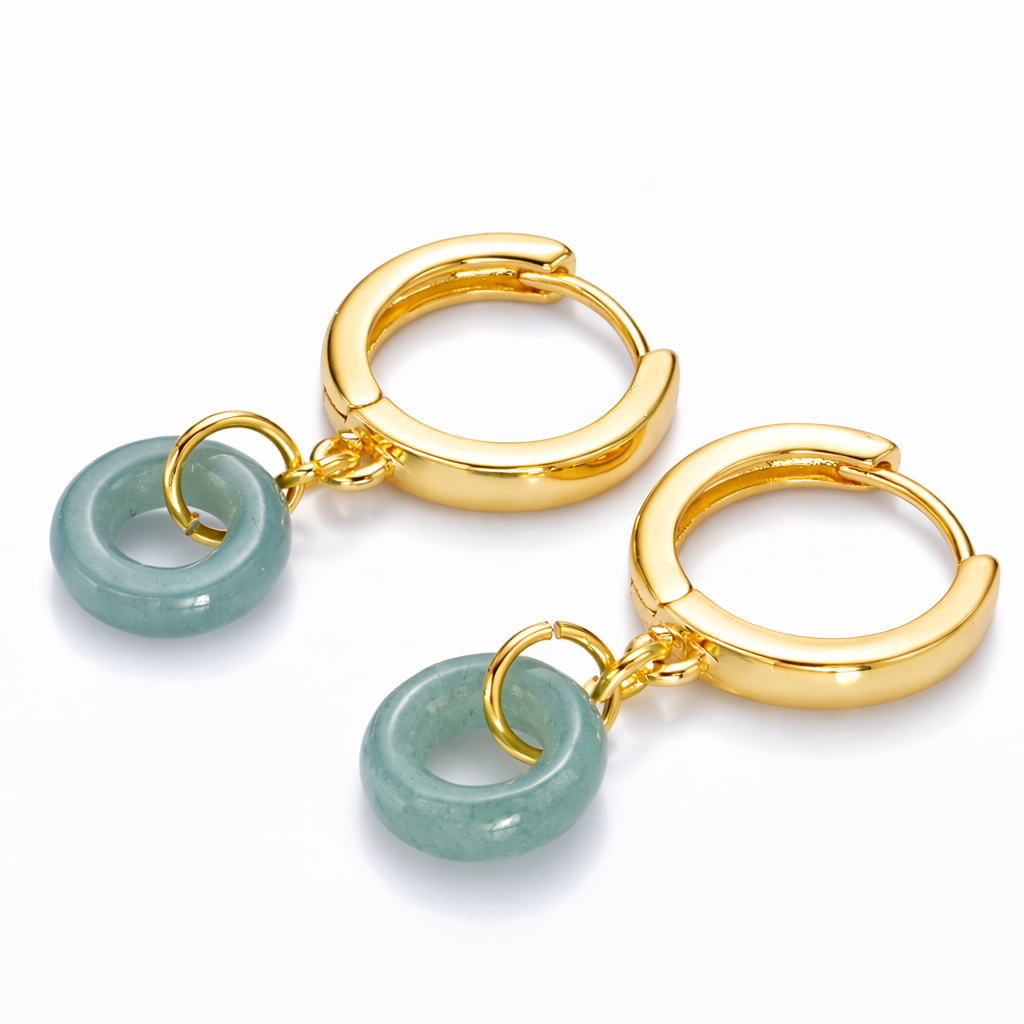Gold hoop earrings with green jade-like charms