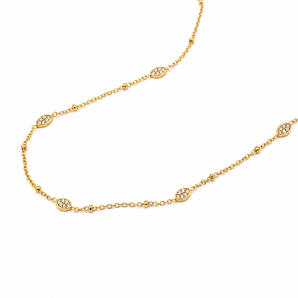 A delicate yellow gold chain necklace featuring oval links, each inlaid with small clear gemstones