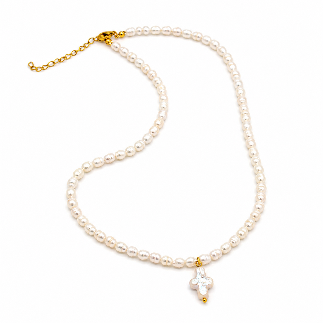 A pearl necklace with a gold clasp and extender chain, featuring a small white pearl cross pendant with gold accents