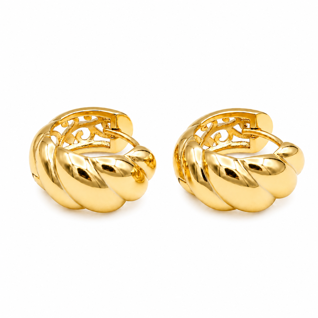 A pair of gold huggie hoop earrings with a twisted, rope-like textured design