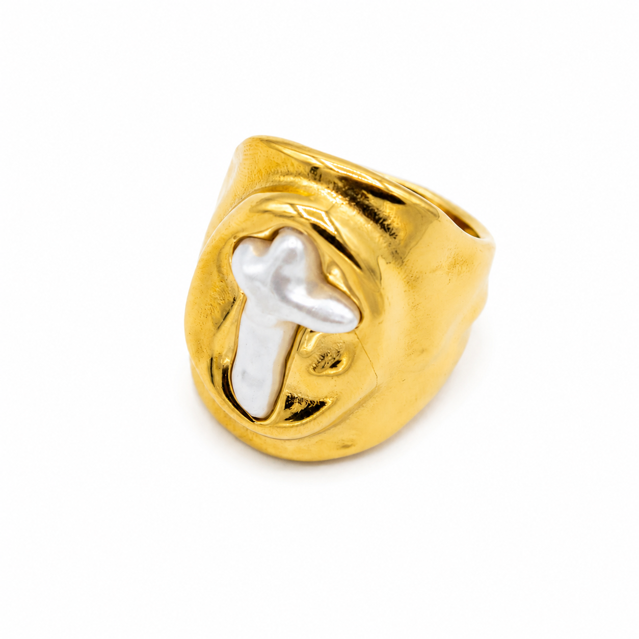 A gold ring with a textured, organic shape and a polished white cross inlay
