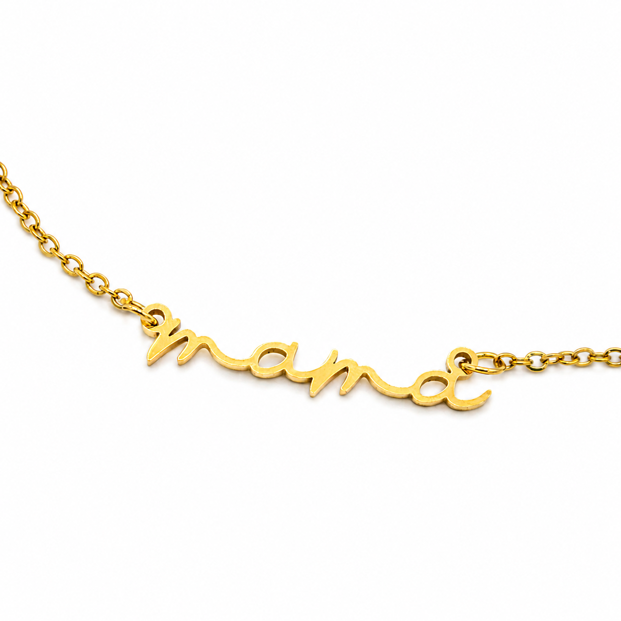 A gold nameplate necklace spelling 'mama' in cursive script, attached to a delicate gold chain