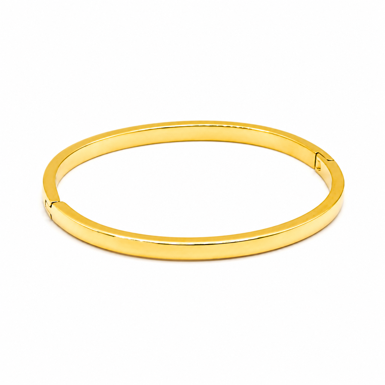 A polished yellow gold hinged bangle bracelet 