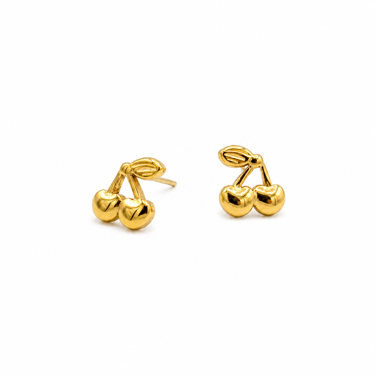 A pair of gold stud earrings shaped like cherries