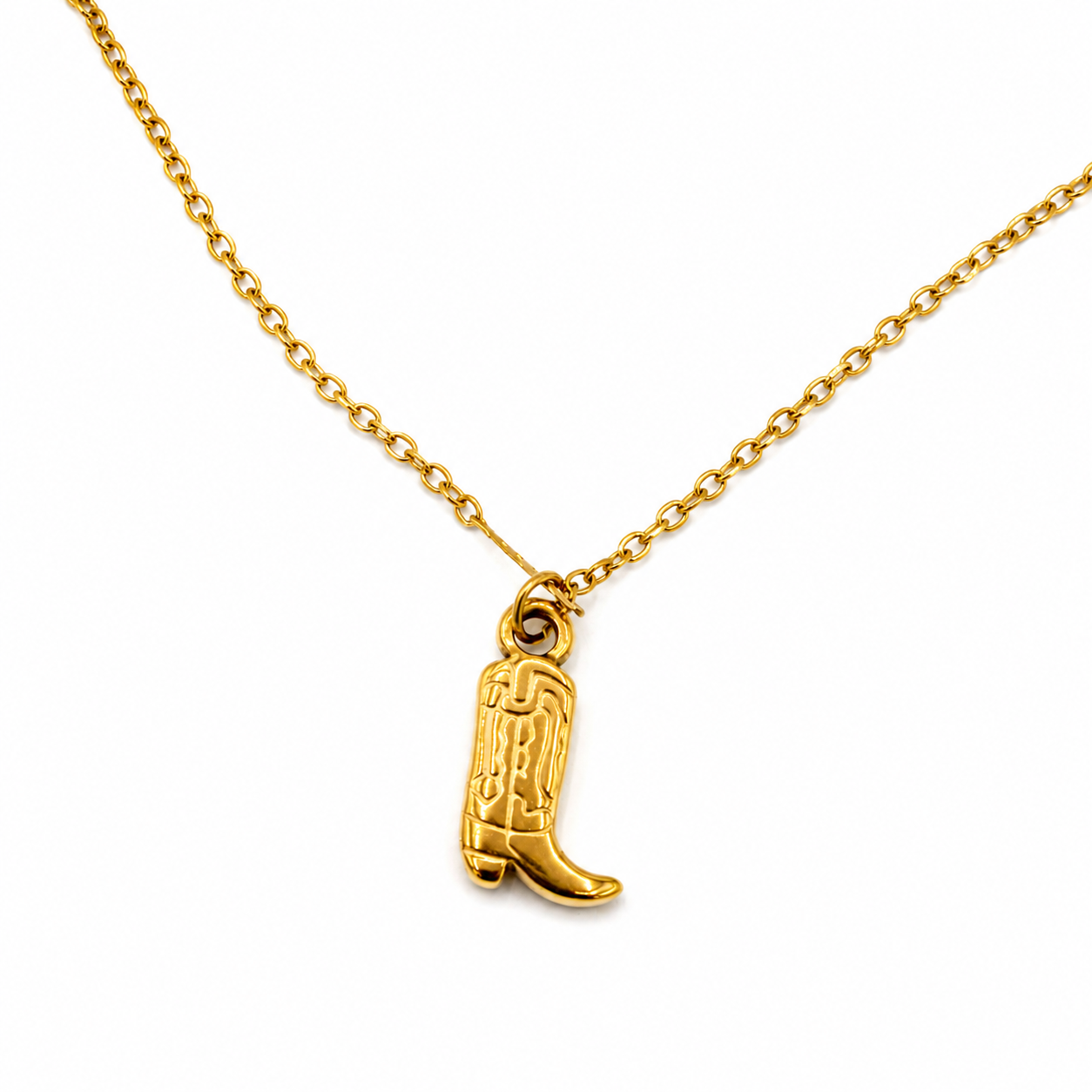 A gold chain necklace featuring a small cowboy boot pendant