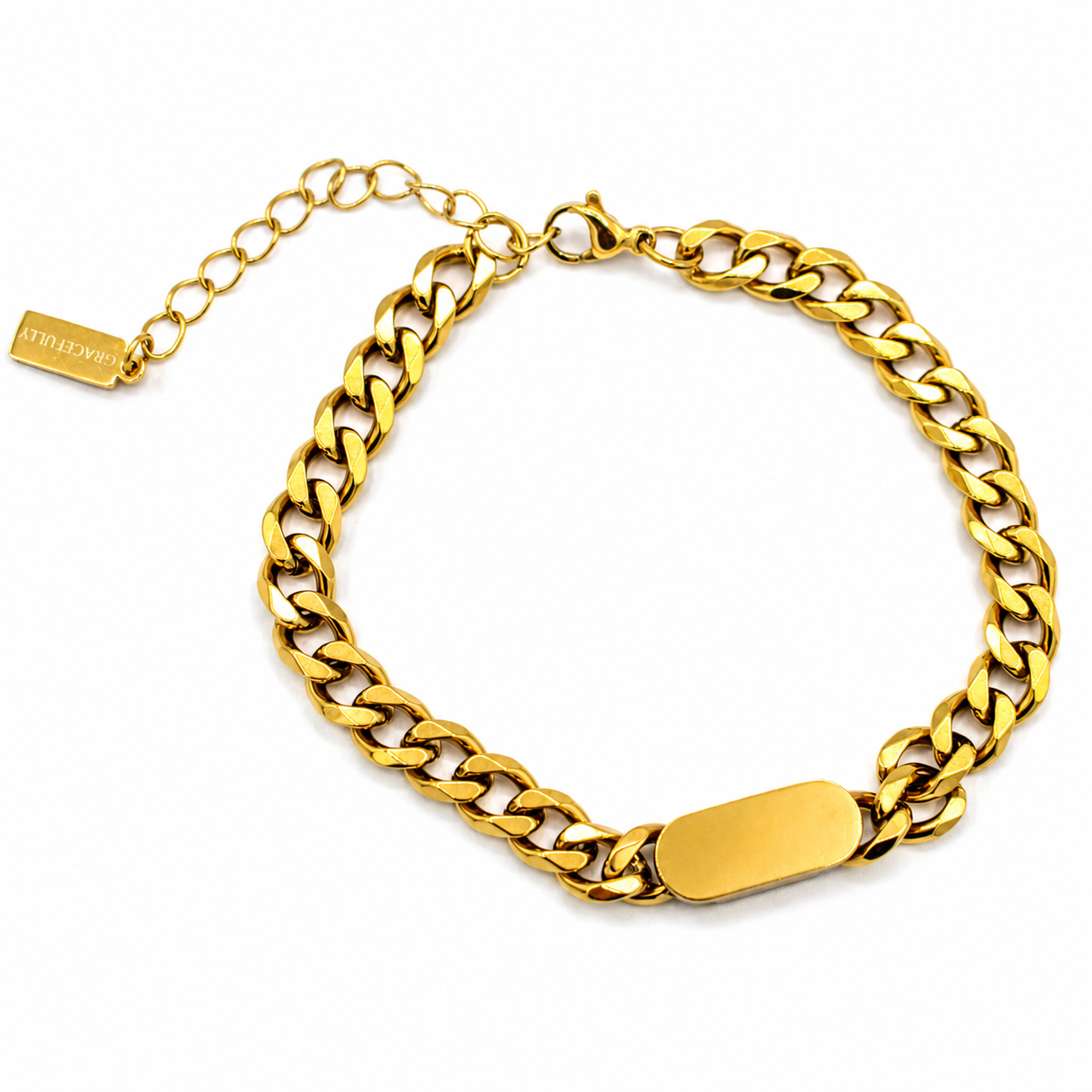 A gold-tone Cuban link chain bracelet with a polished rectangular plate at the front and an adjustable chain extender with a tag