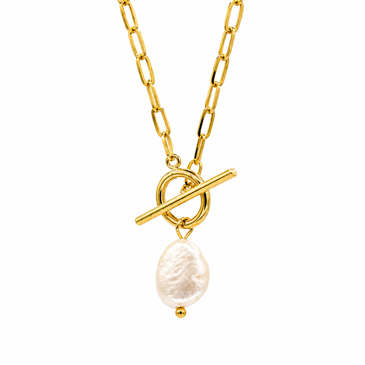 A gold chain necklace featuring a toggle clasp pendant with a baroque pearl dangle