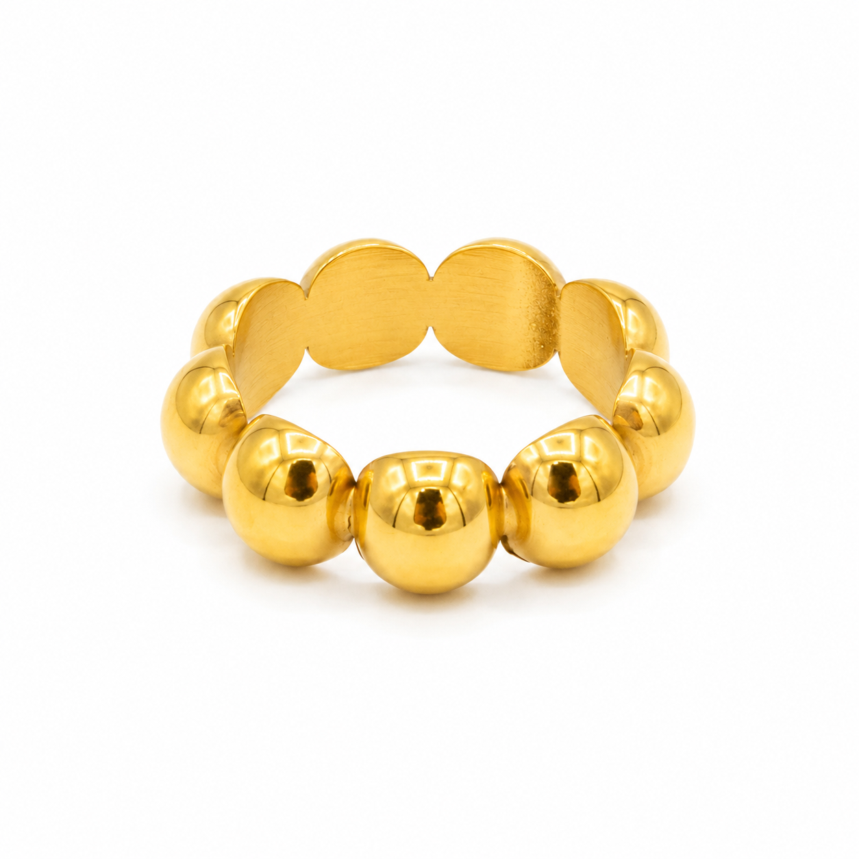 A gold beaded stretch ring with alternating smooth round beads and oval disc-like links