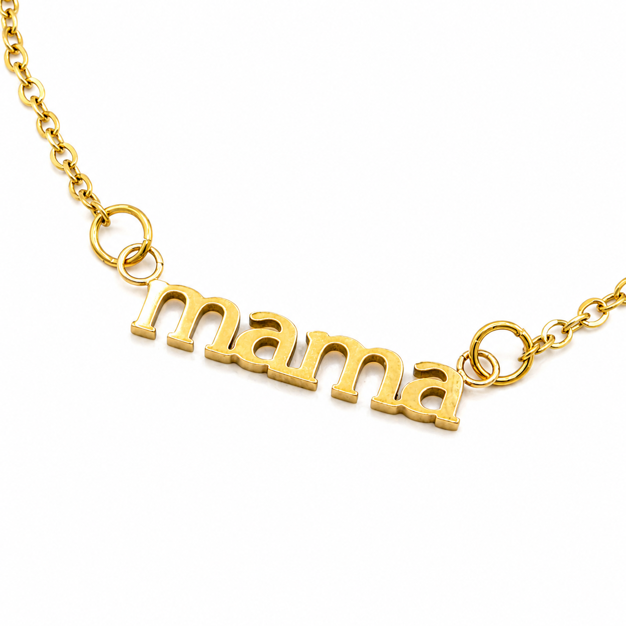 A gold nameplate necklace spelling 'mama' in lowercase cursive-style letters, suspended from a delicate gold chain