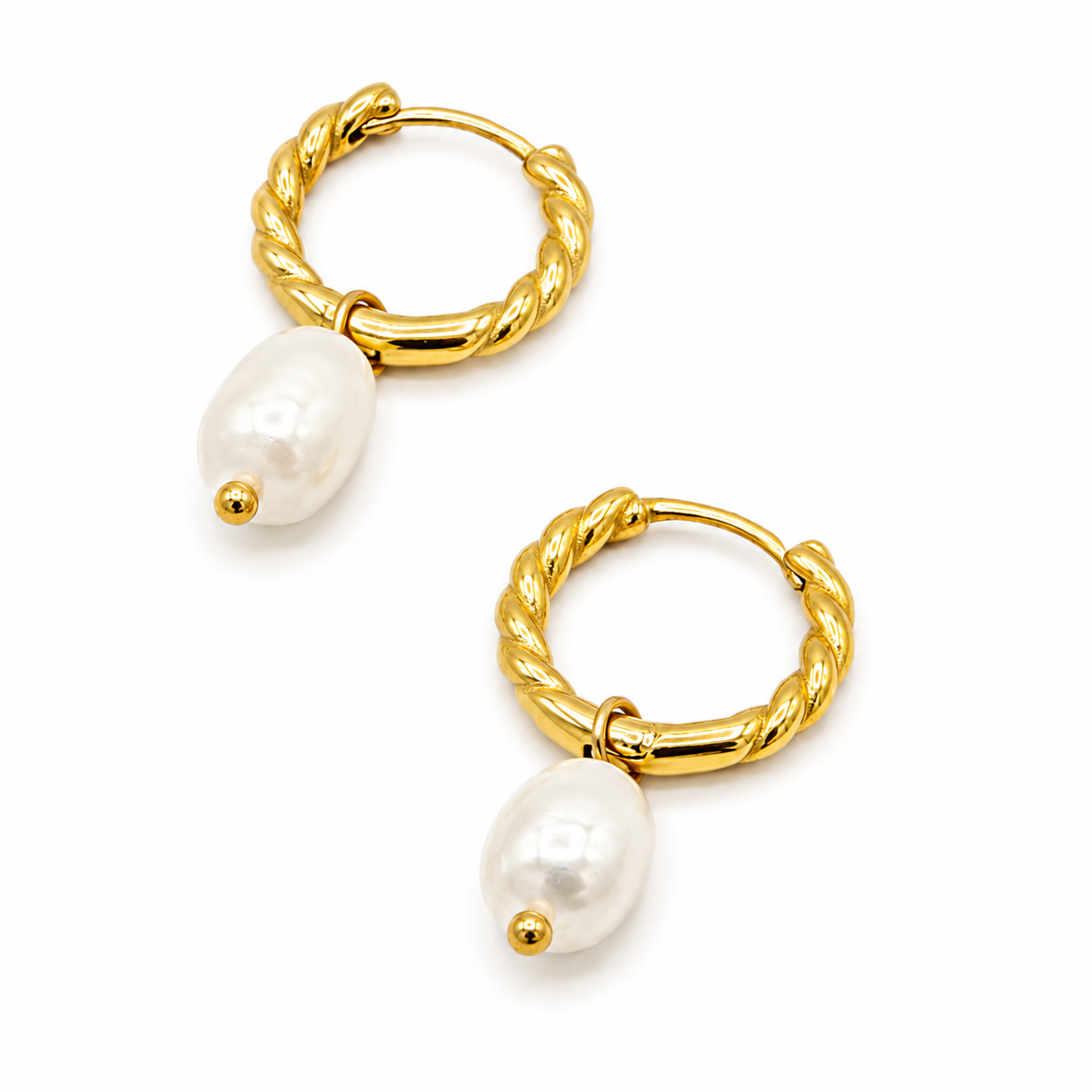 A pair of gold huggie hoop earrings with twisted rope detailing and a dangling white freshwater pearl