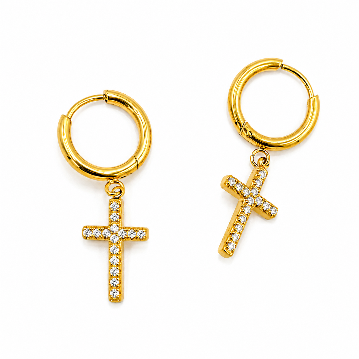 A pair of gold hoop earrings with dangling cross charms paved with small clear stones