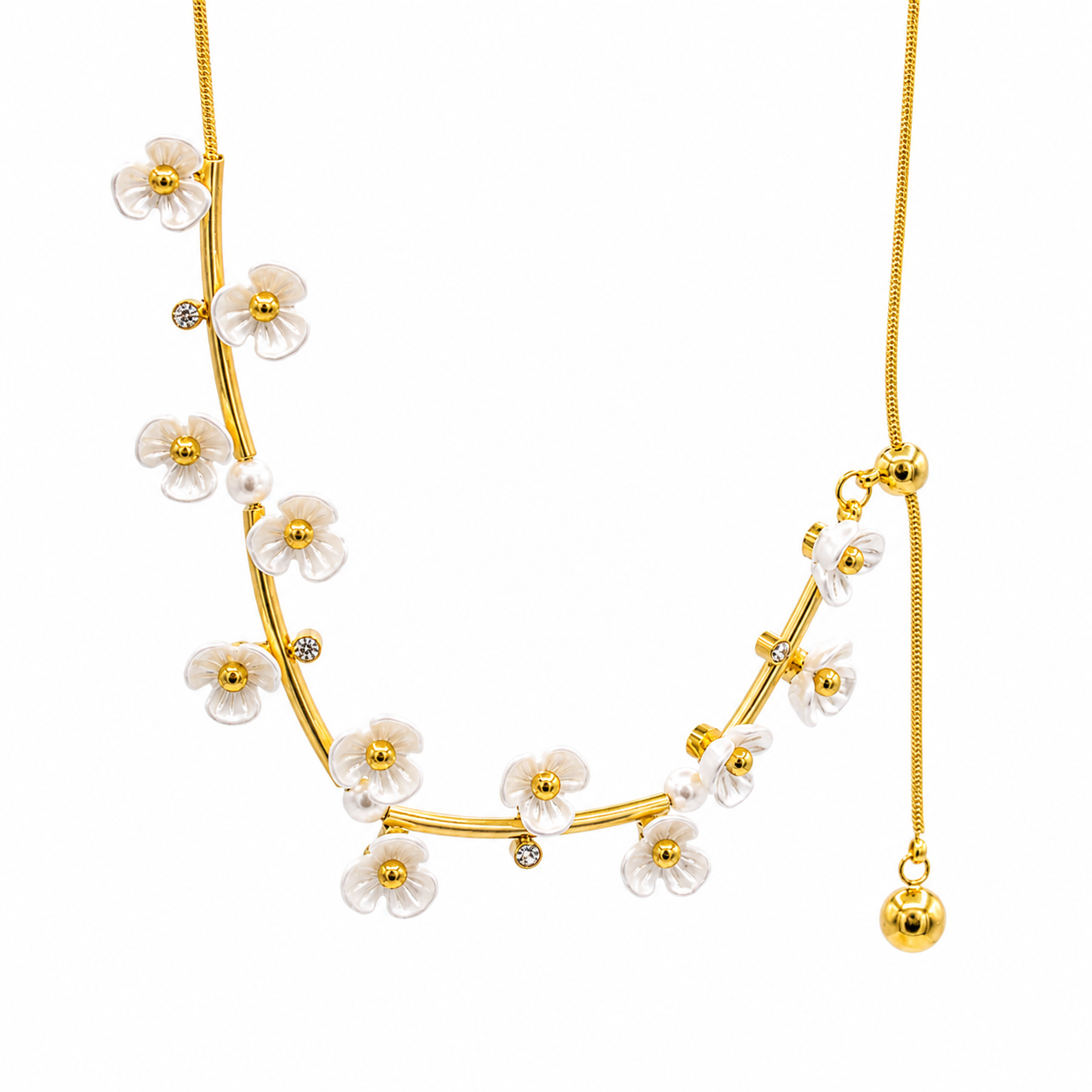 A gold-tone necklace featuring a curved branch design adorned with white pearl-like flowers, small white pearls, and tiny clear rhinestone accents