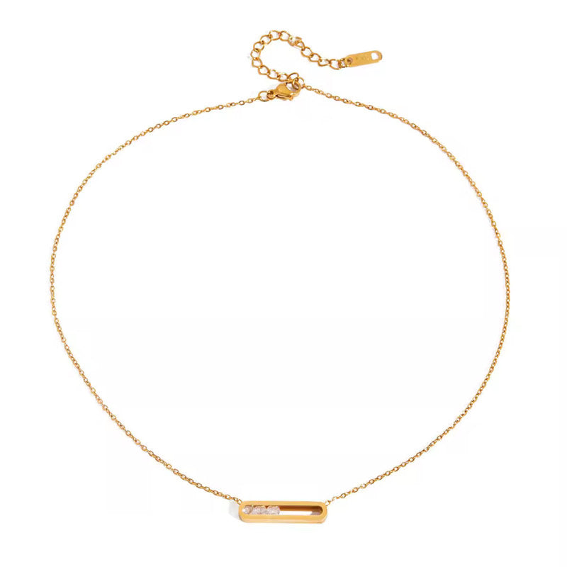 Gold necklace with a bar pendant