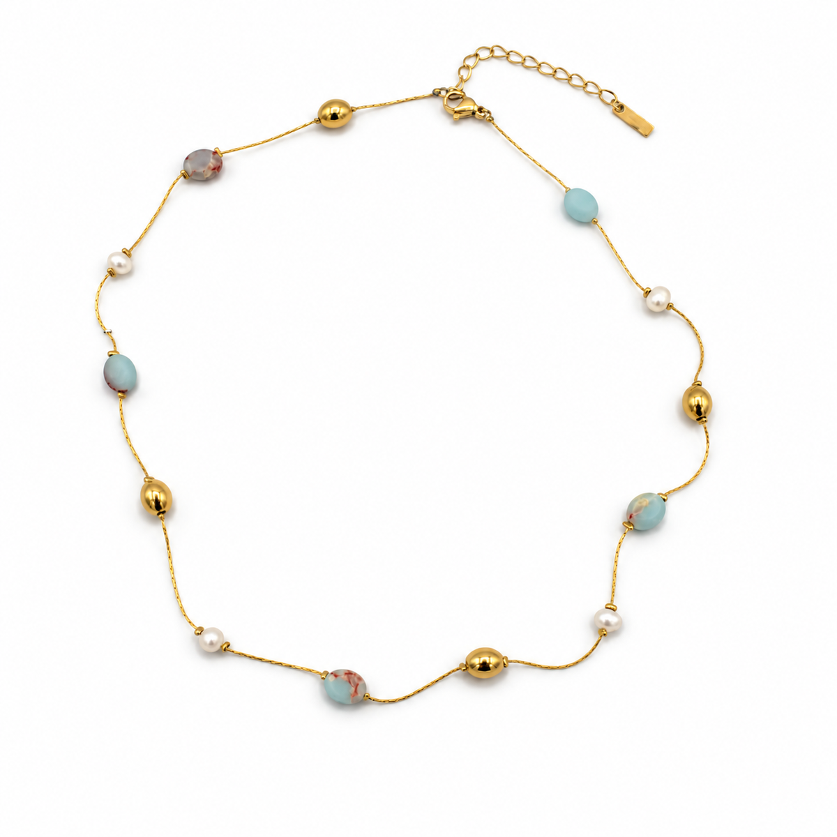 A delicate gold chain necklace featuring light blue oval beads, small white pearl-like beads, and polished gold spacer beads
