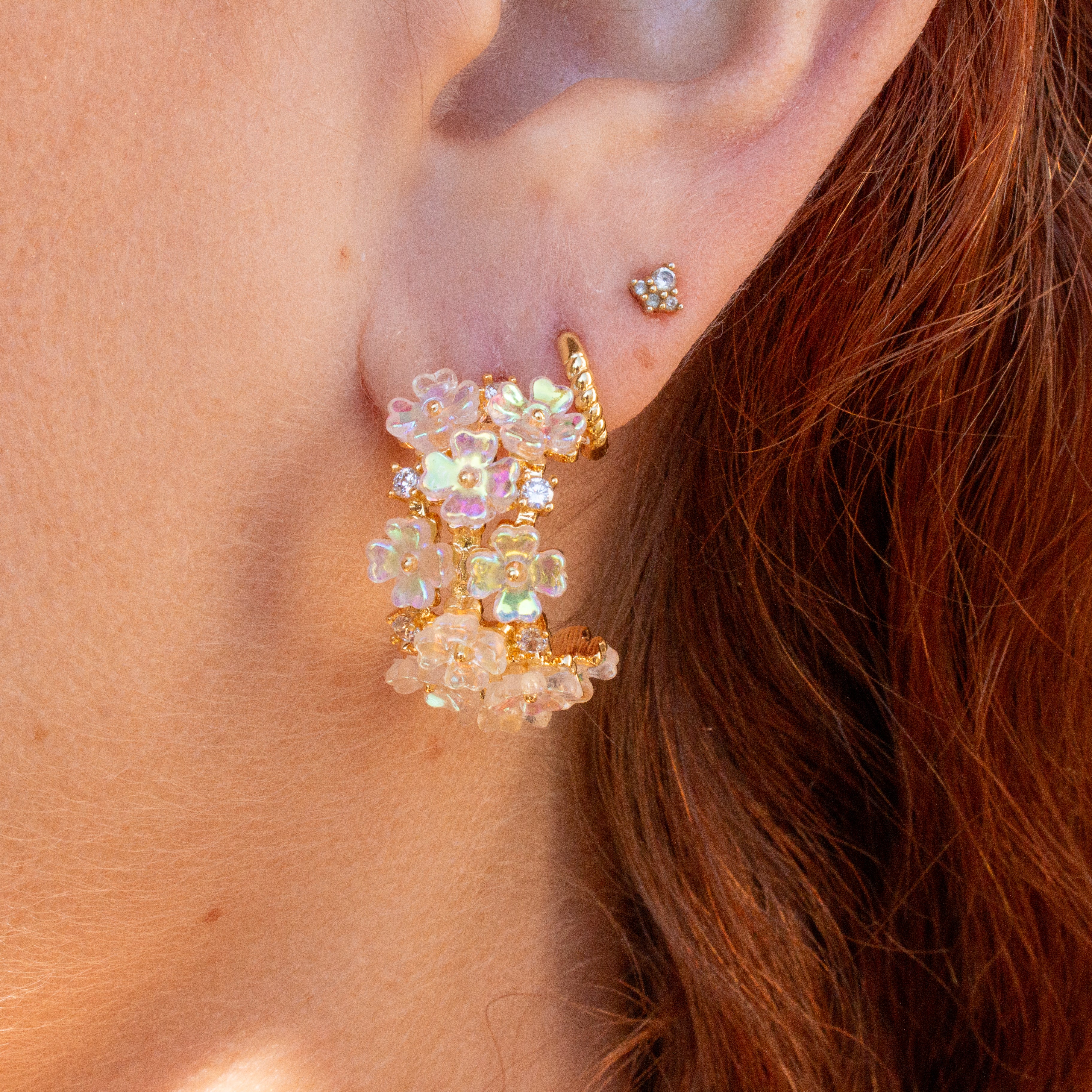 Floral gold earrings and a small stud