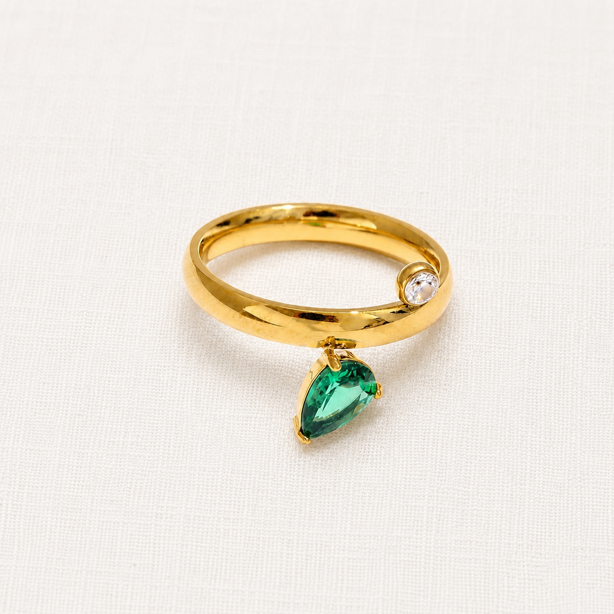 Gold ring with a green gemstone 