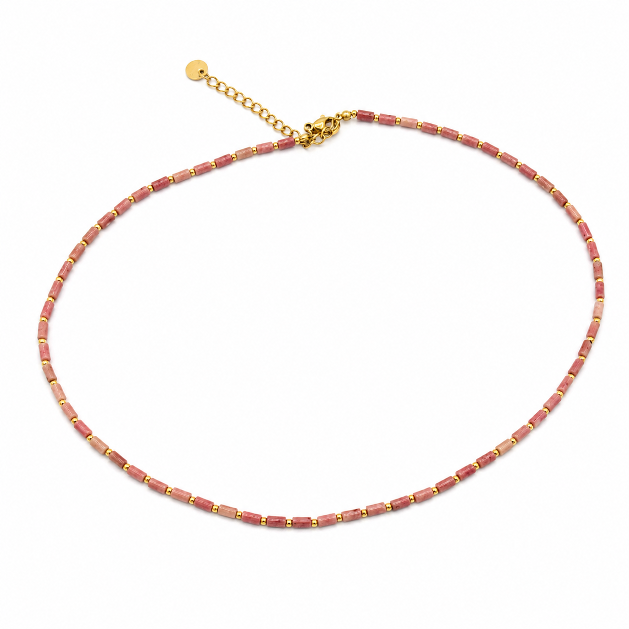 A delicate beaded necklace made of small pinkish-red rectangular beads separated by gold spacers, with a gold clasp and extender chain