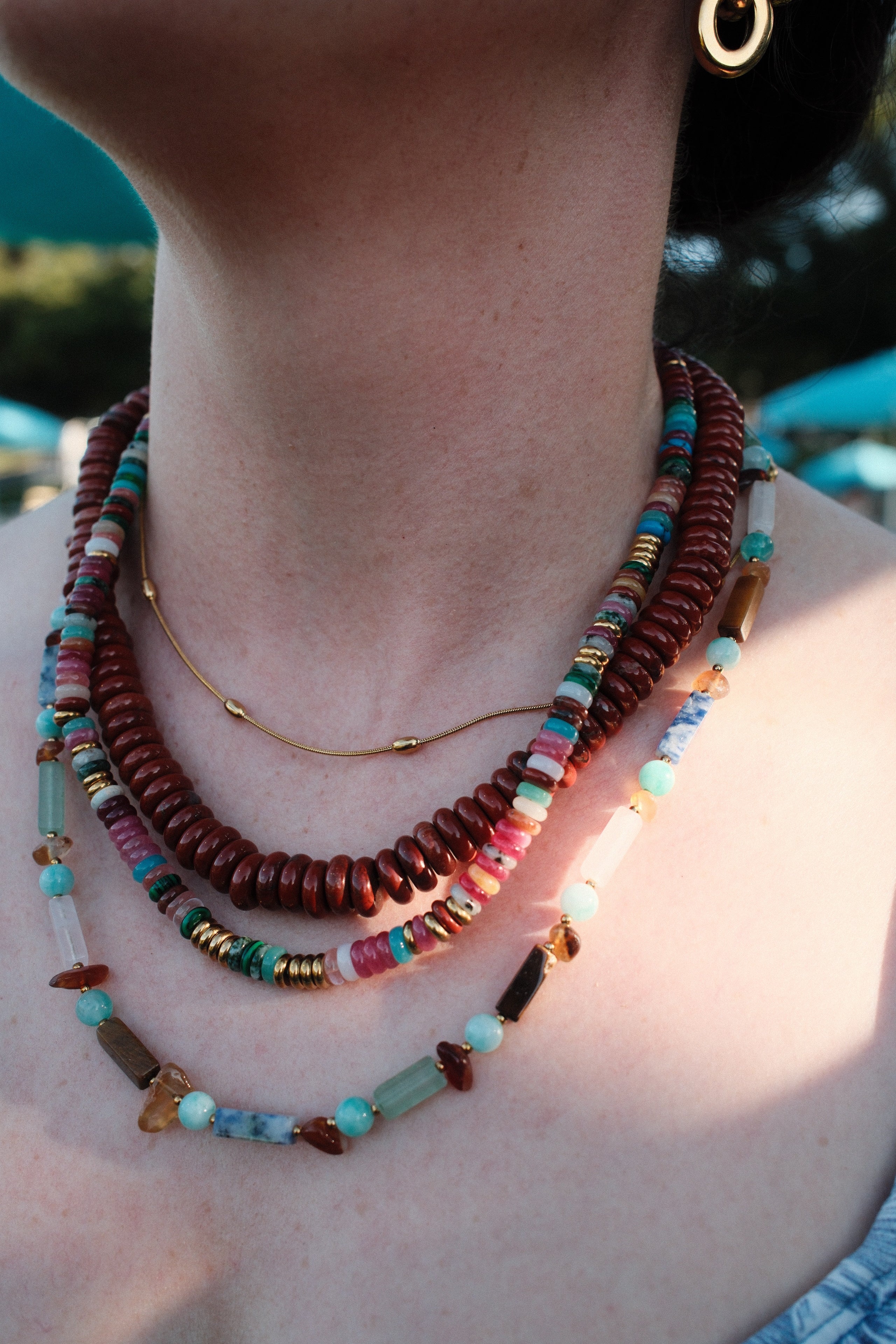 Bohemian beaded necklace set. The set features multiple strands including dark reddish-brown beads