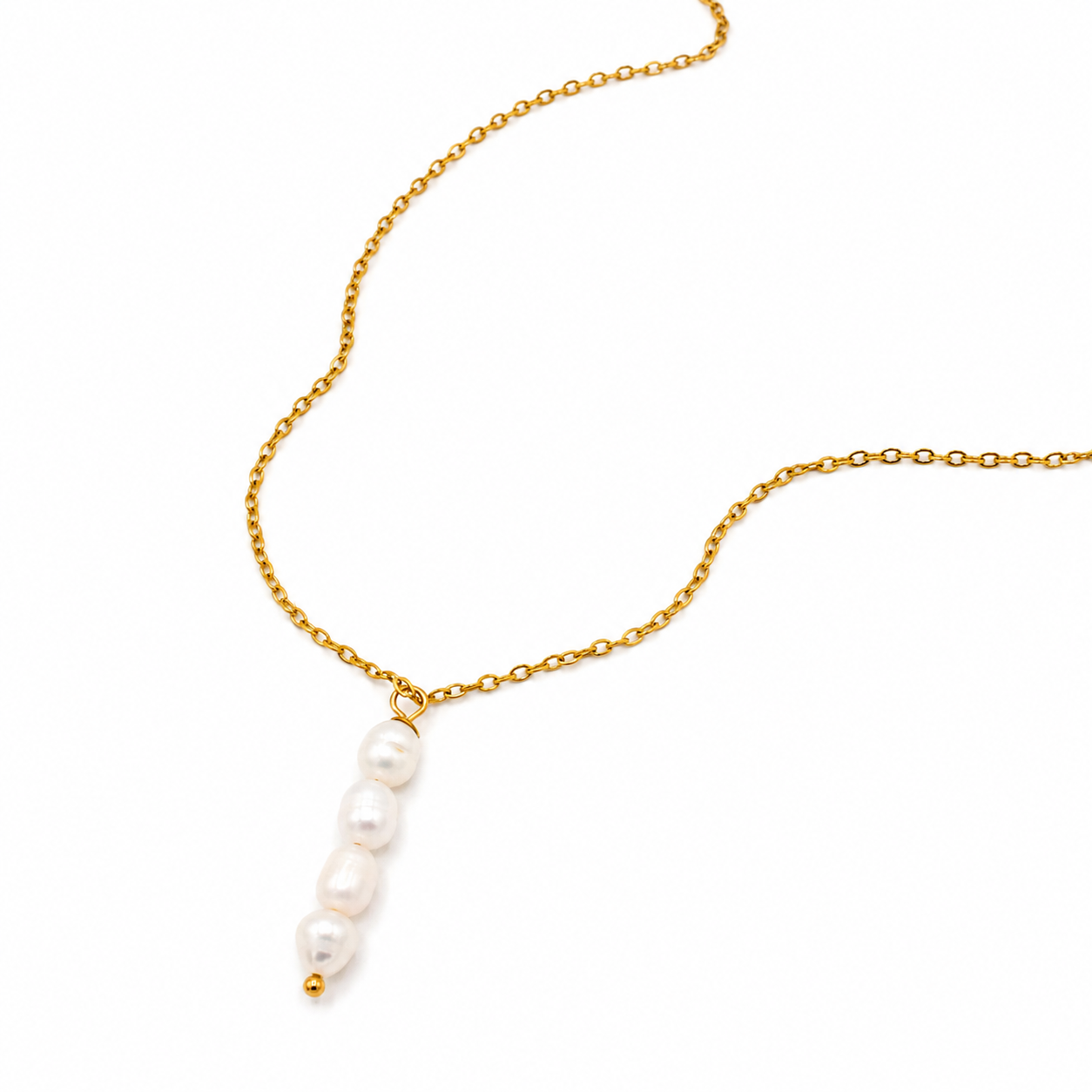 A delicate gold chain necklace featuring a vertical drop of four white baroque pearls
