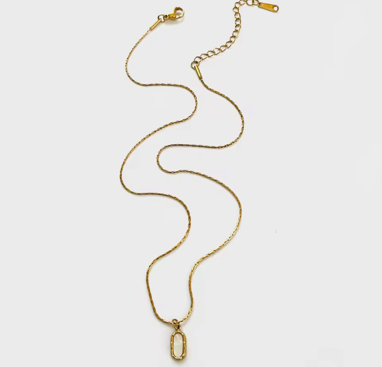 White Oval Stone Set in Gold Necklace