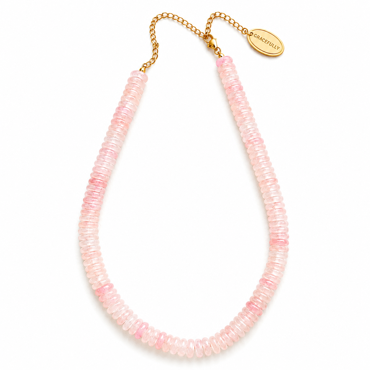 A delicate necklace made of multiple strands of small, translucent light pink beads, finished with a gold-tone chain extender 