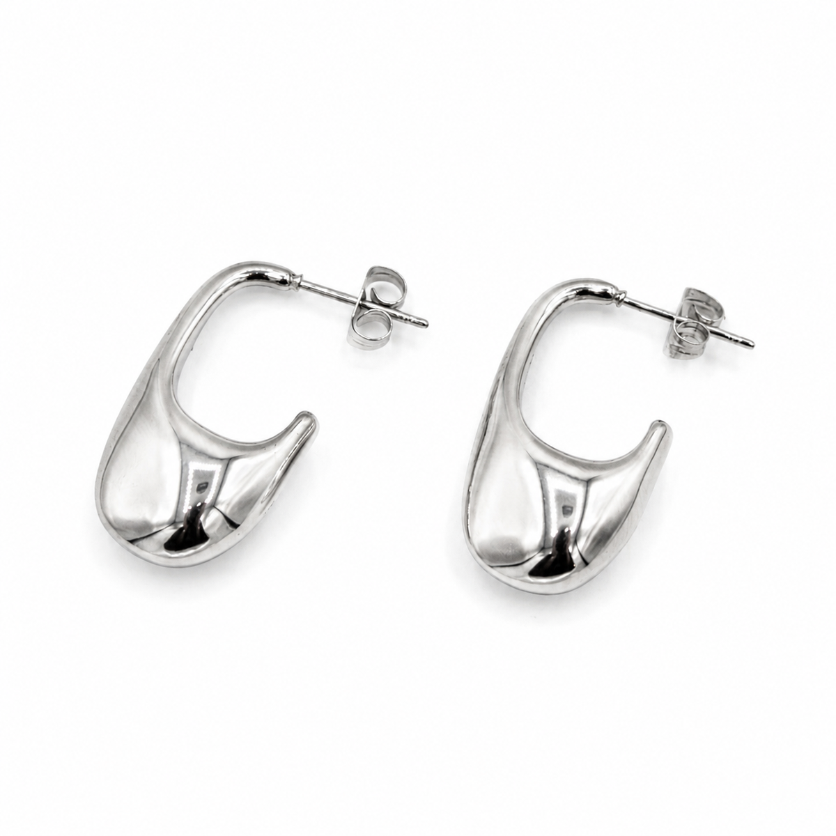 A pair of polished silver hoop earrings with a unique, organic teardrop-like curve design