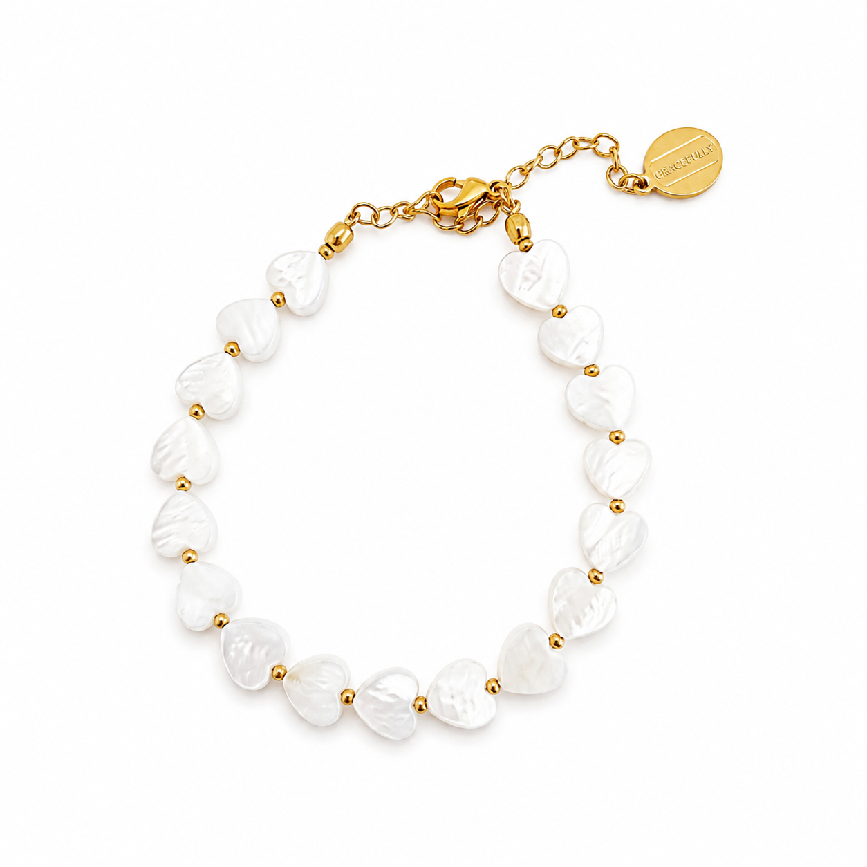 A gold chain bracelet with irregular white shell beads separated by small gold spacer beads, featuring a lobster clasp, extender chain, and a round gold brand tag