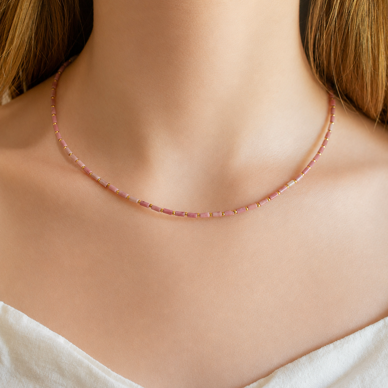 A delicate pink beaded necklace 
