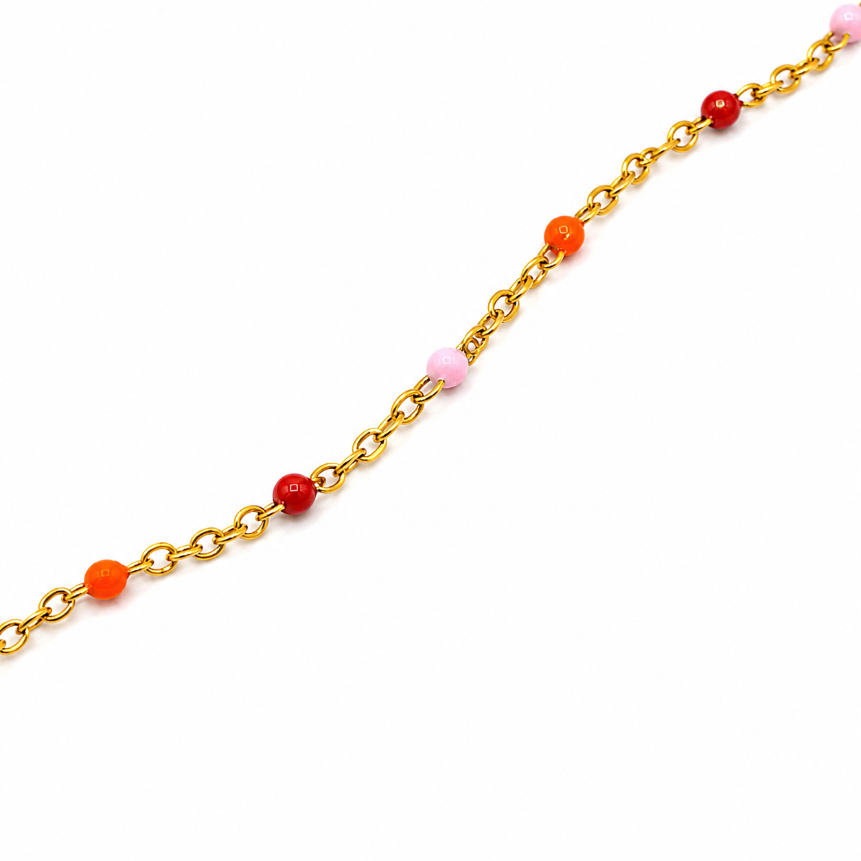 A gold chain bracelet with small, colorful round beads in red, orange, and light pink