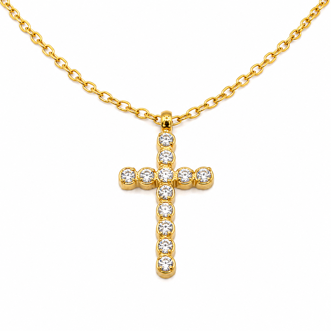 A gold cross pendant necklace adorned with clear round-cut gemstones, suspended from a matching gold chain 