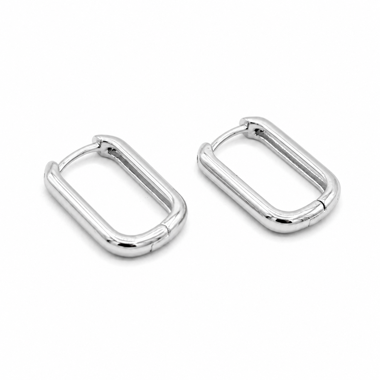 A pair of polished silver-toned metal capsule-style earrings