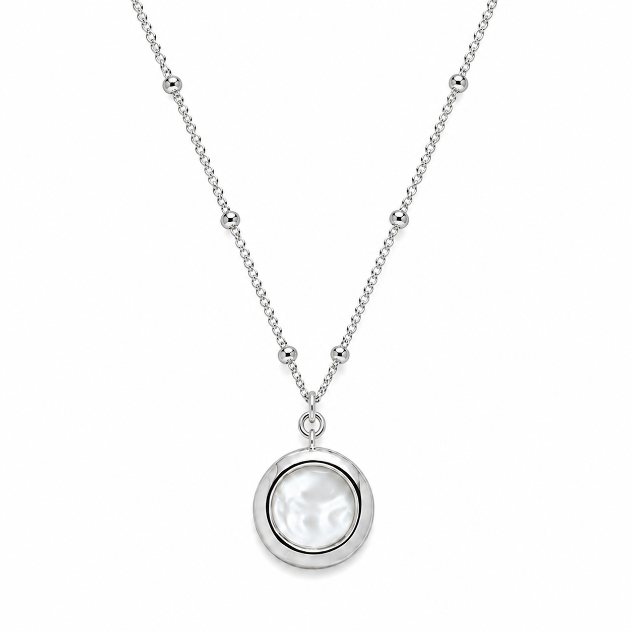 A silver necklace featuring a round bezel-set white pearl pendant, suspended from a delicate silver beaded chain
