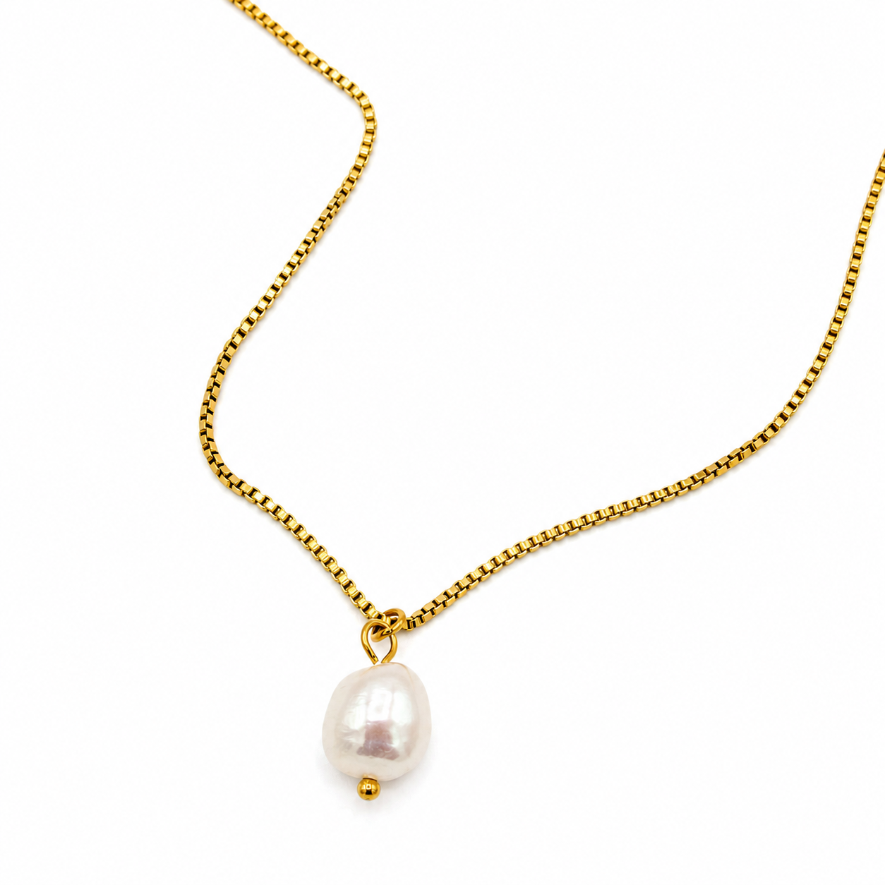A delicate gold chain necklace featuring a single irregular white baroque pearl pendant with a small gold bead accent below it