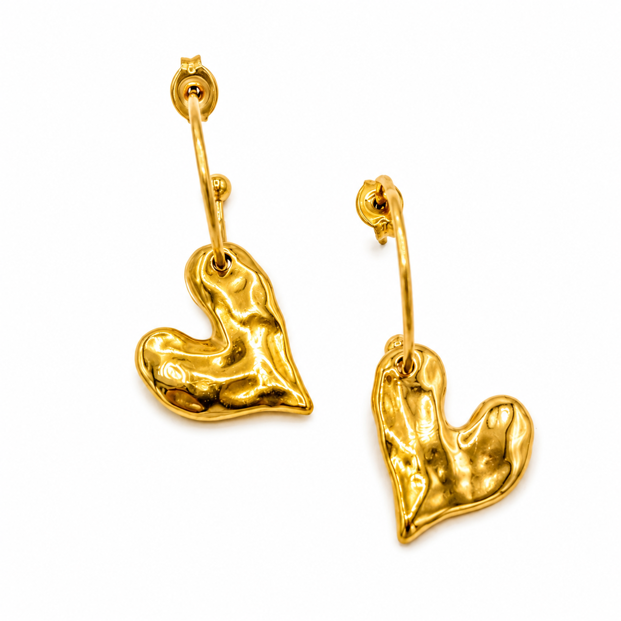 A pair of textured gold drop earrings with a wavy, organic heart-shaped pendant and a small curved gold bar above it